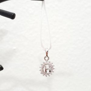 Silver 'H' circled by diamonds Pendant